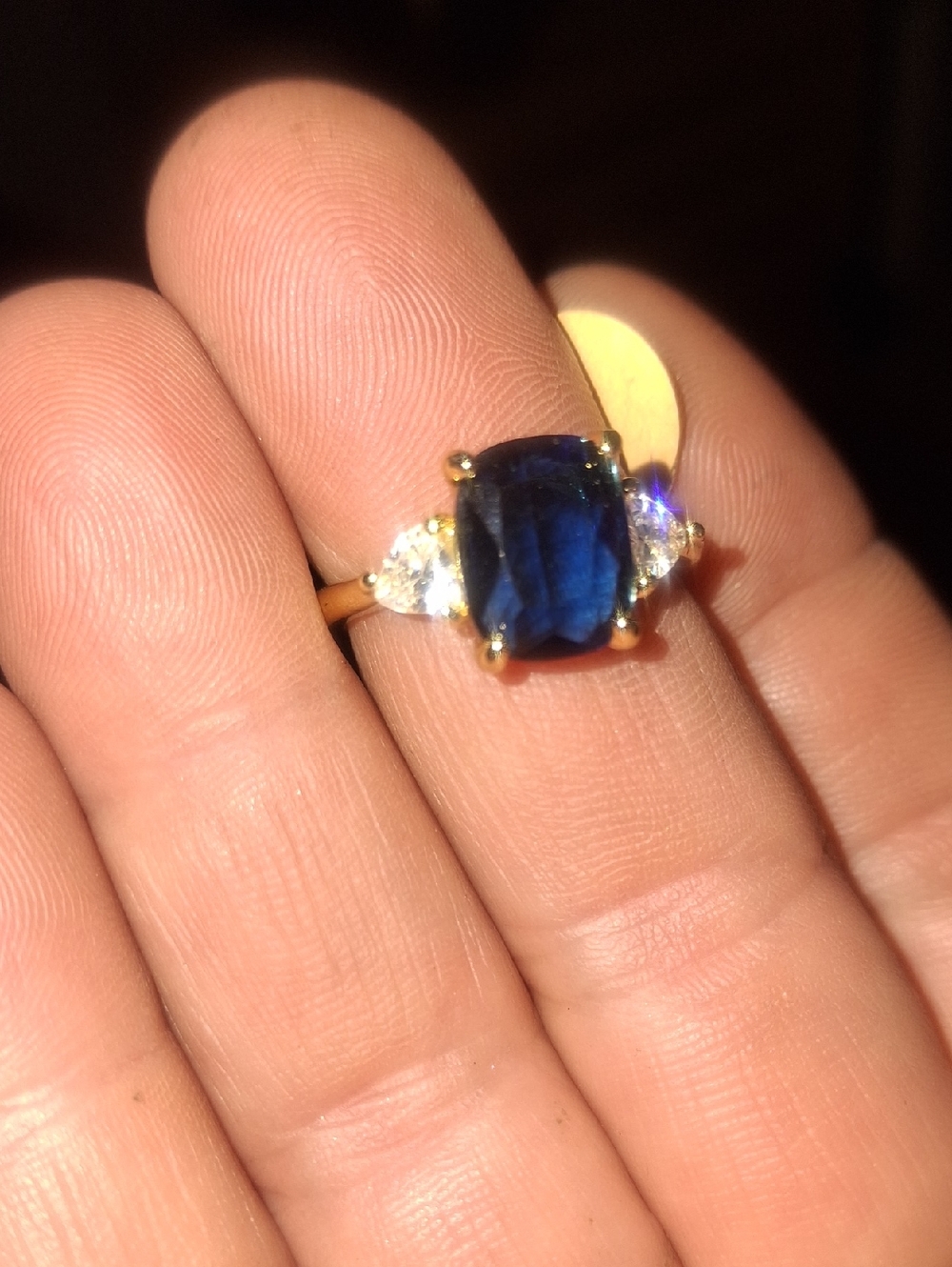 Gold Ring with Deep Blue Sapphire Center and Side Accent Stones